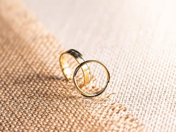 silver ring on brown textile